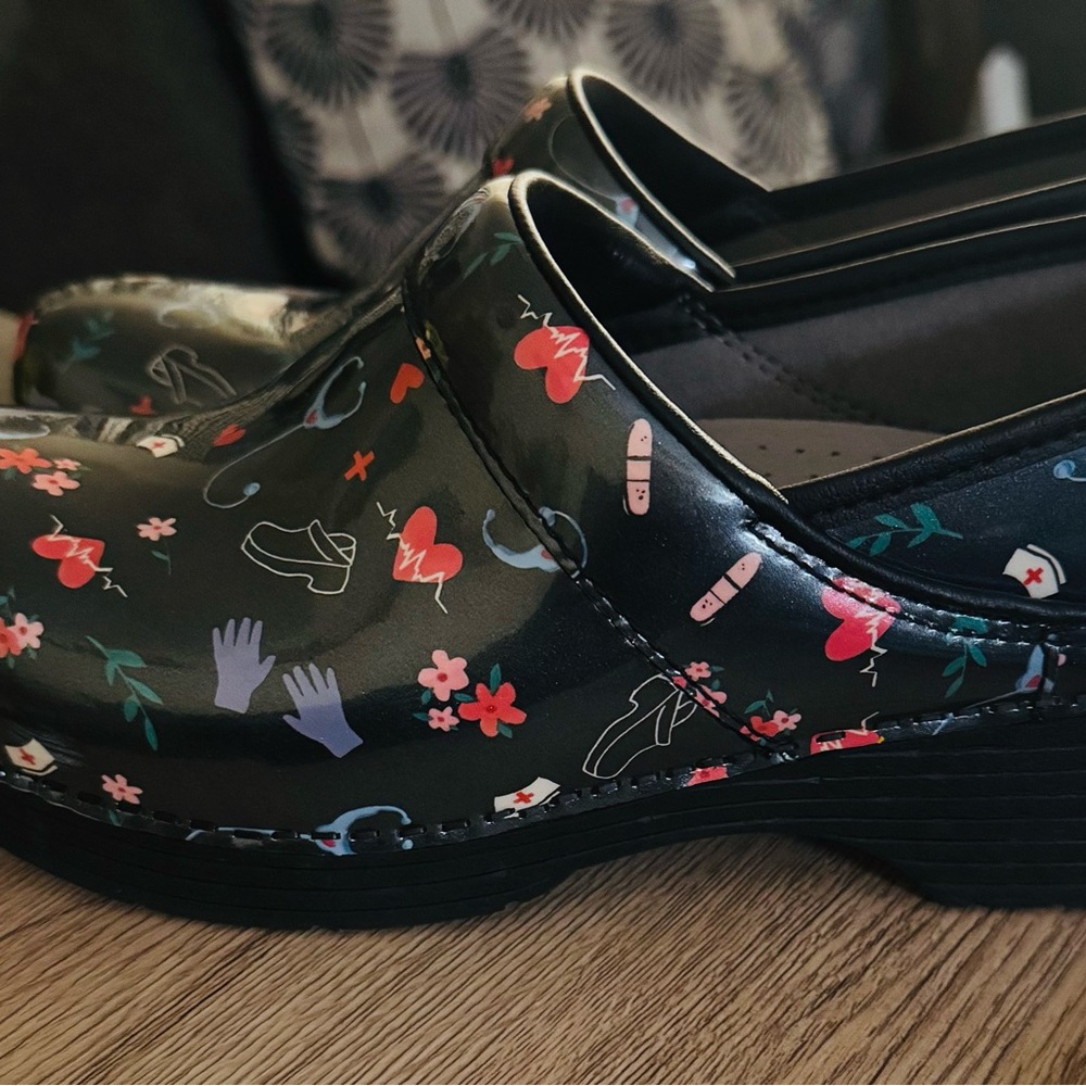 Dansko Black Floral Women's Clogs